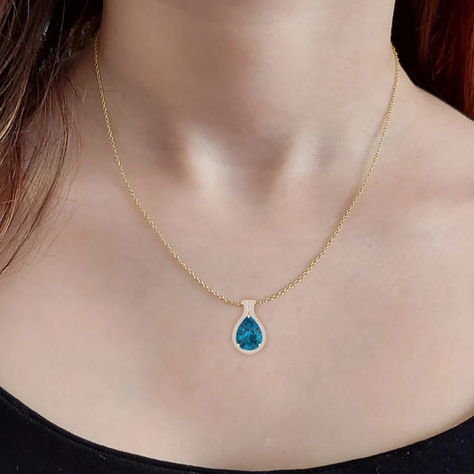 London Blue Topaz Pendant with White Diamond in 18Kt Gold 8.49cts